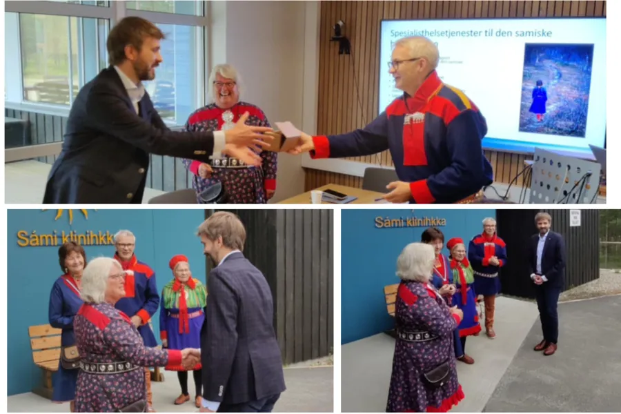 En mann og kvinne som håndhilser på en gruppe mennesker