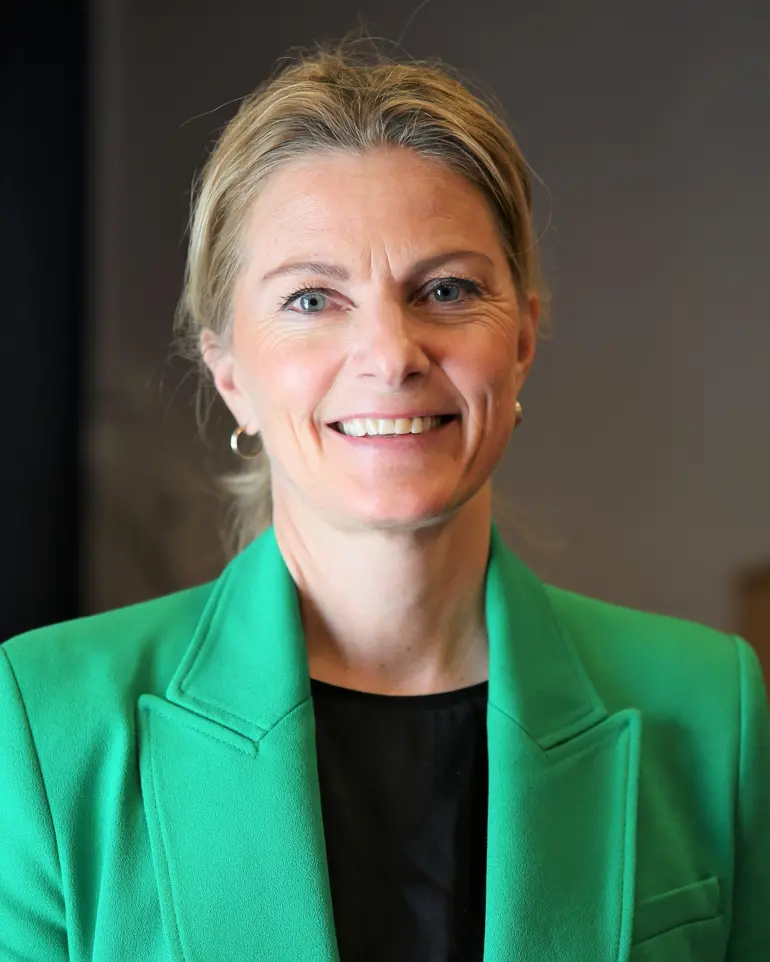 En person som smiler for kameraet